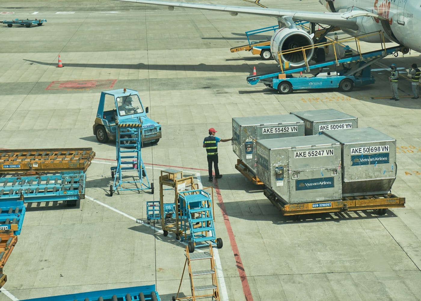 Air cargo containers waiting on the apron to be loaded
