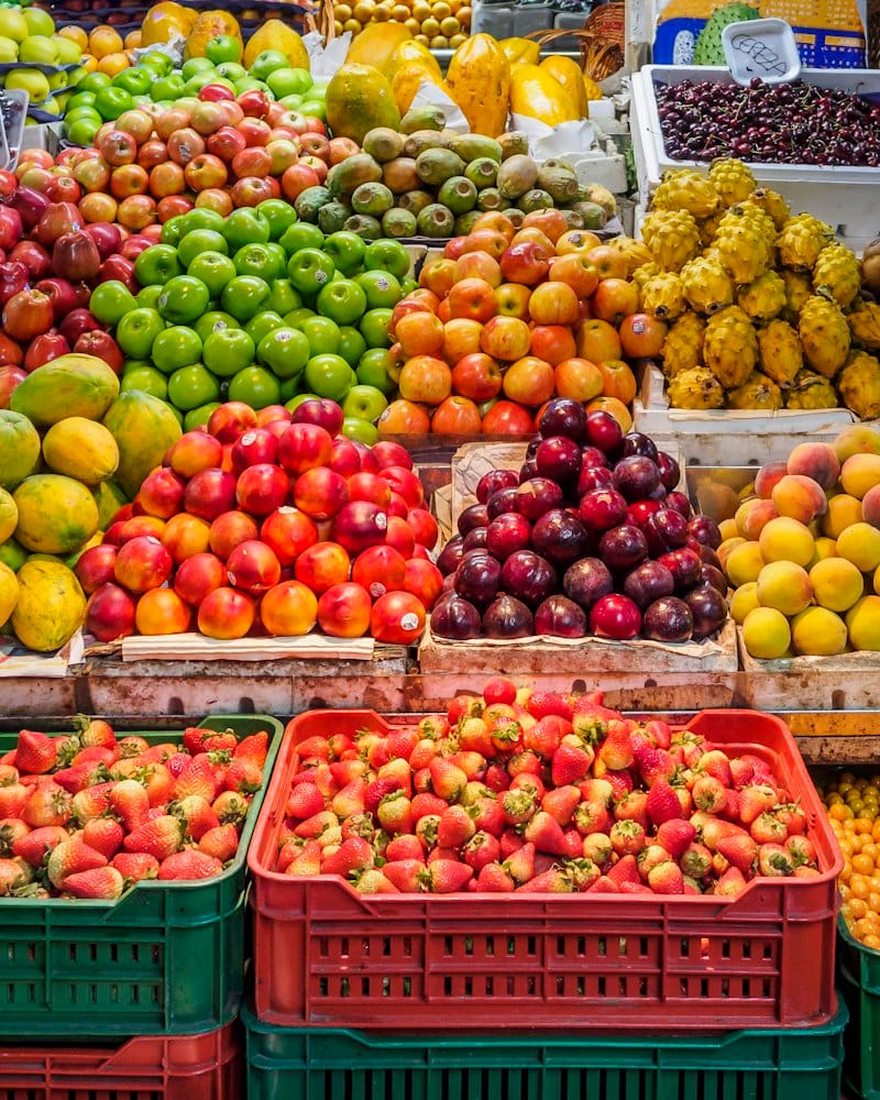 Fresh fruit and strawberries in crates