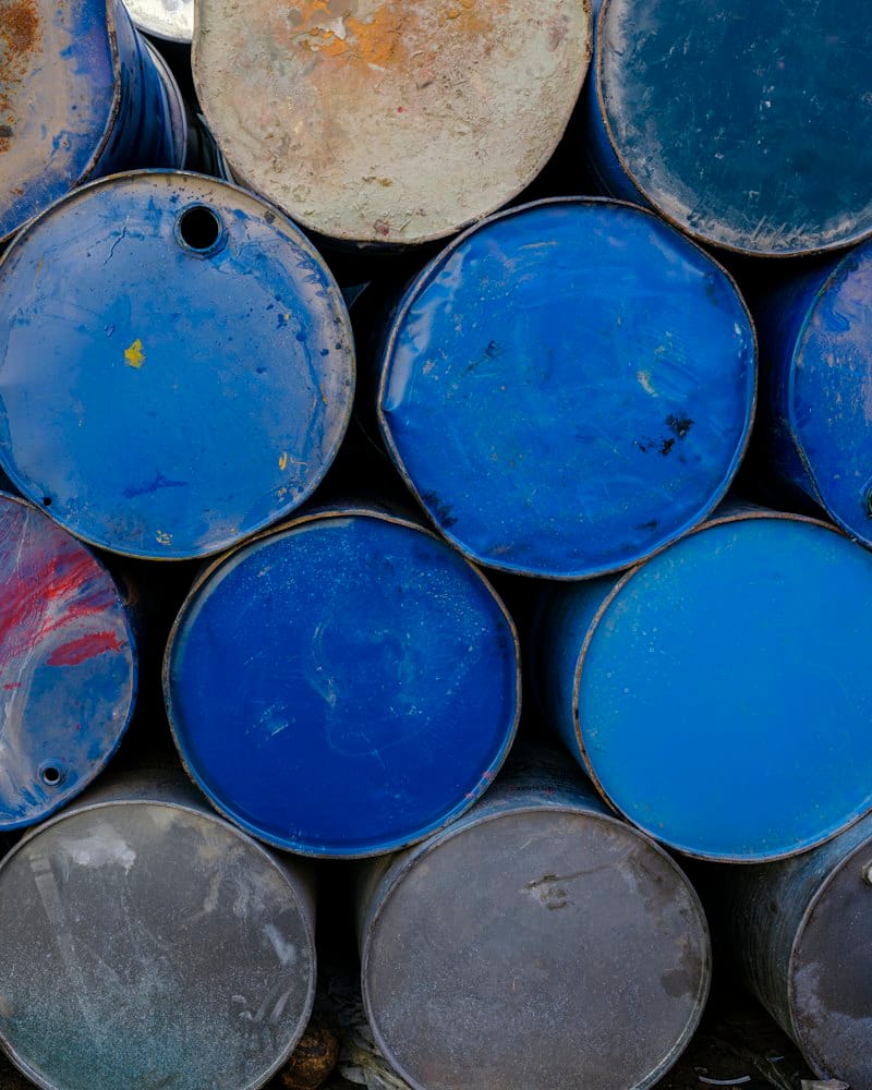 Stacked blue and grey steel drums