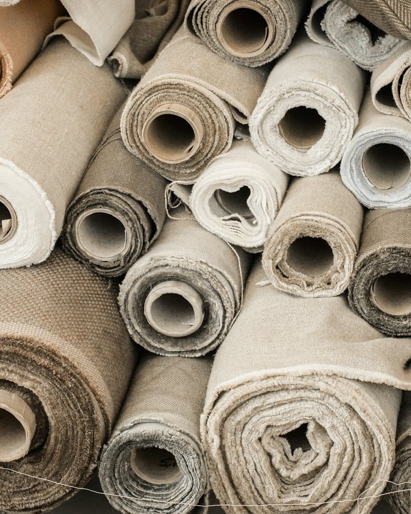 Rolls of raw fabric stacked on top of each other