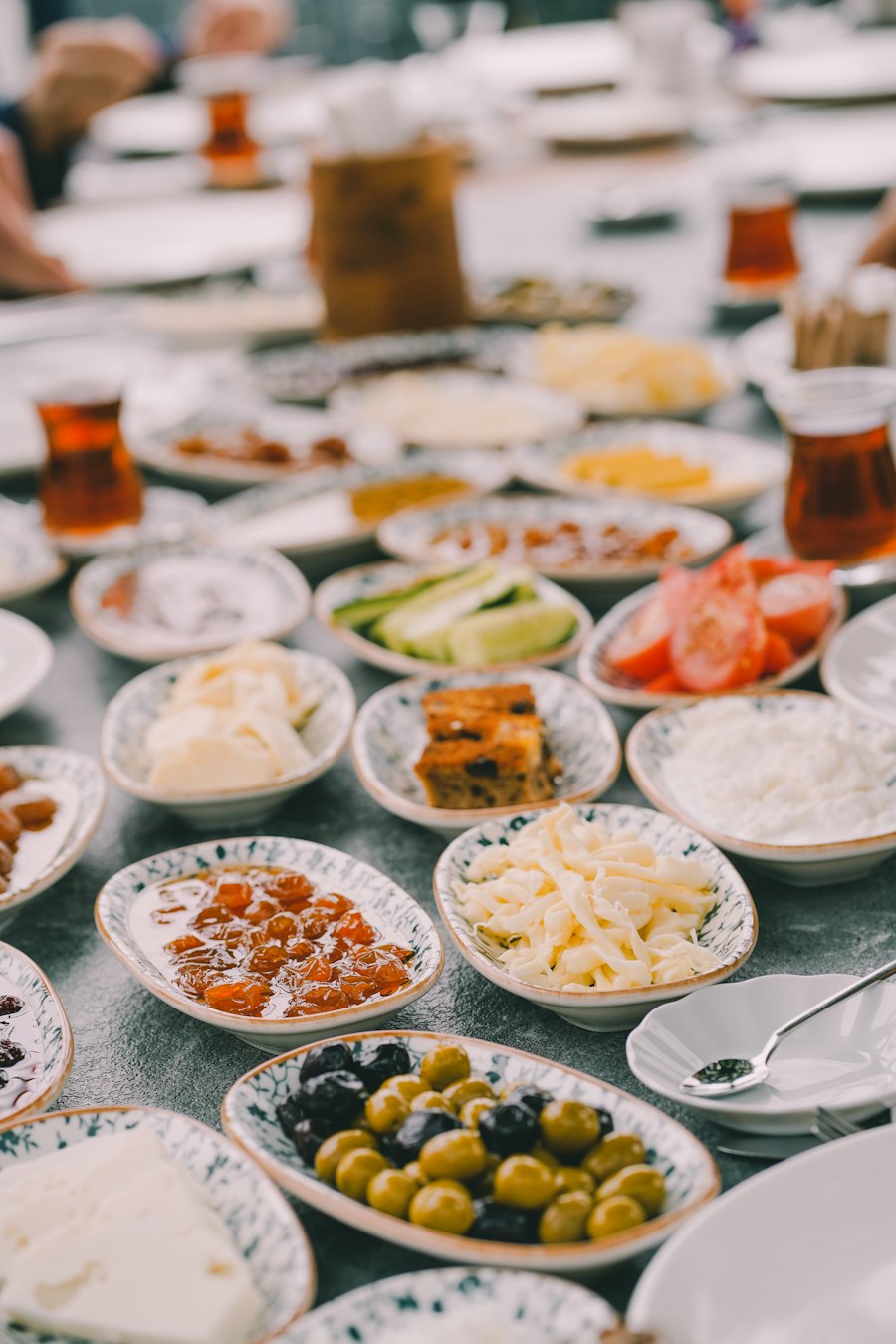 Breakfast in small dishes with tulip-shaped tea glasses