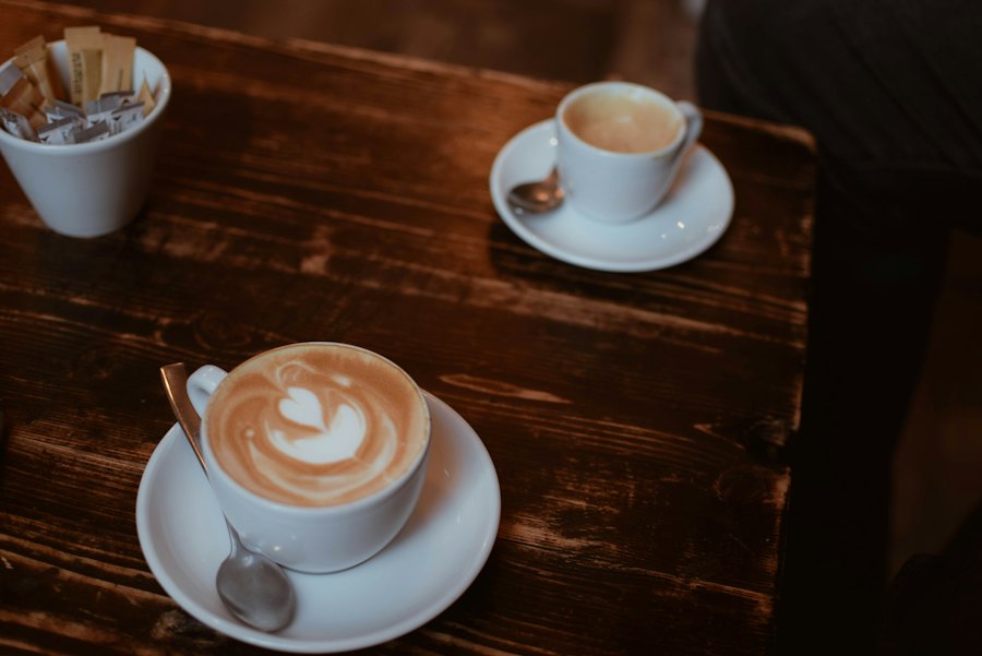 Two cups of coffee on a wooden table