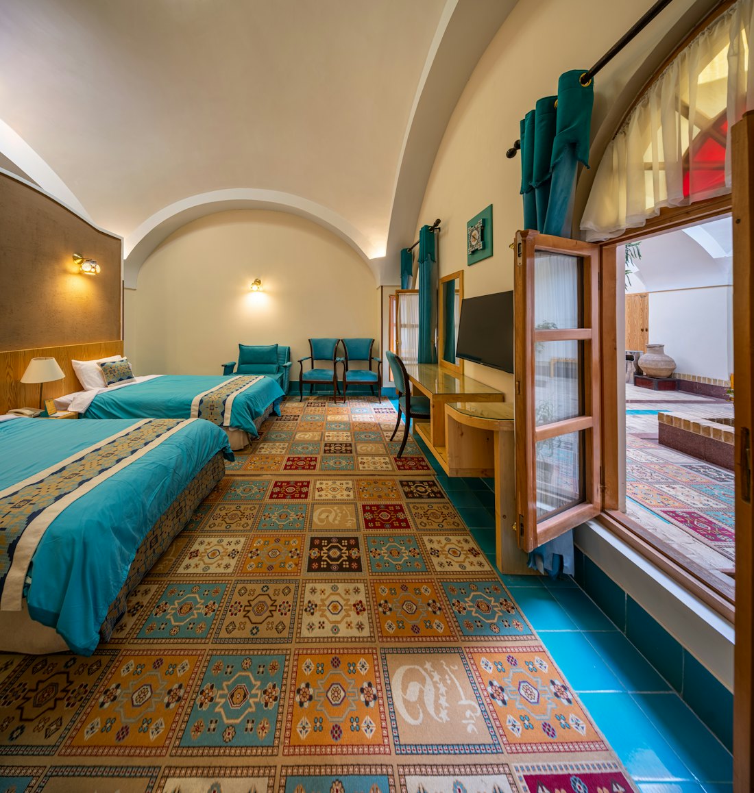 A room with its vaulted ceiling and original tiled floor
