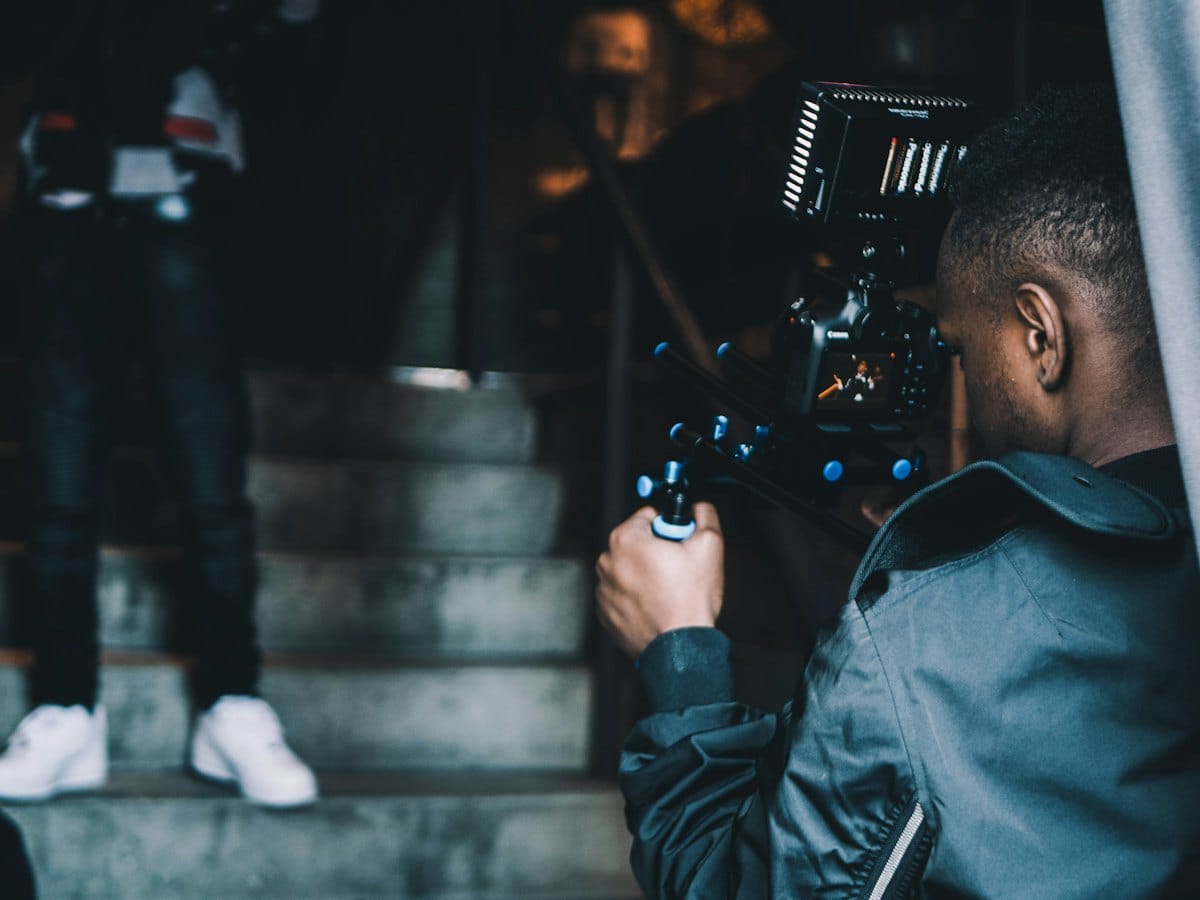 A content team filming a social video on a staircase