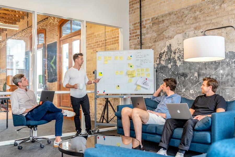 A team meeting on sofas in a bright open office